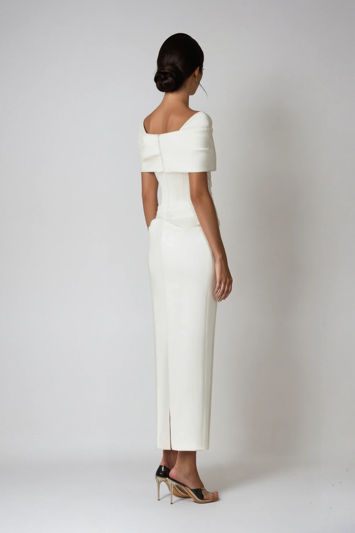 Rear view of ivory off-shoulder maxi dress with corset seaming and split hem