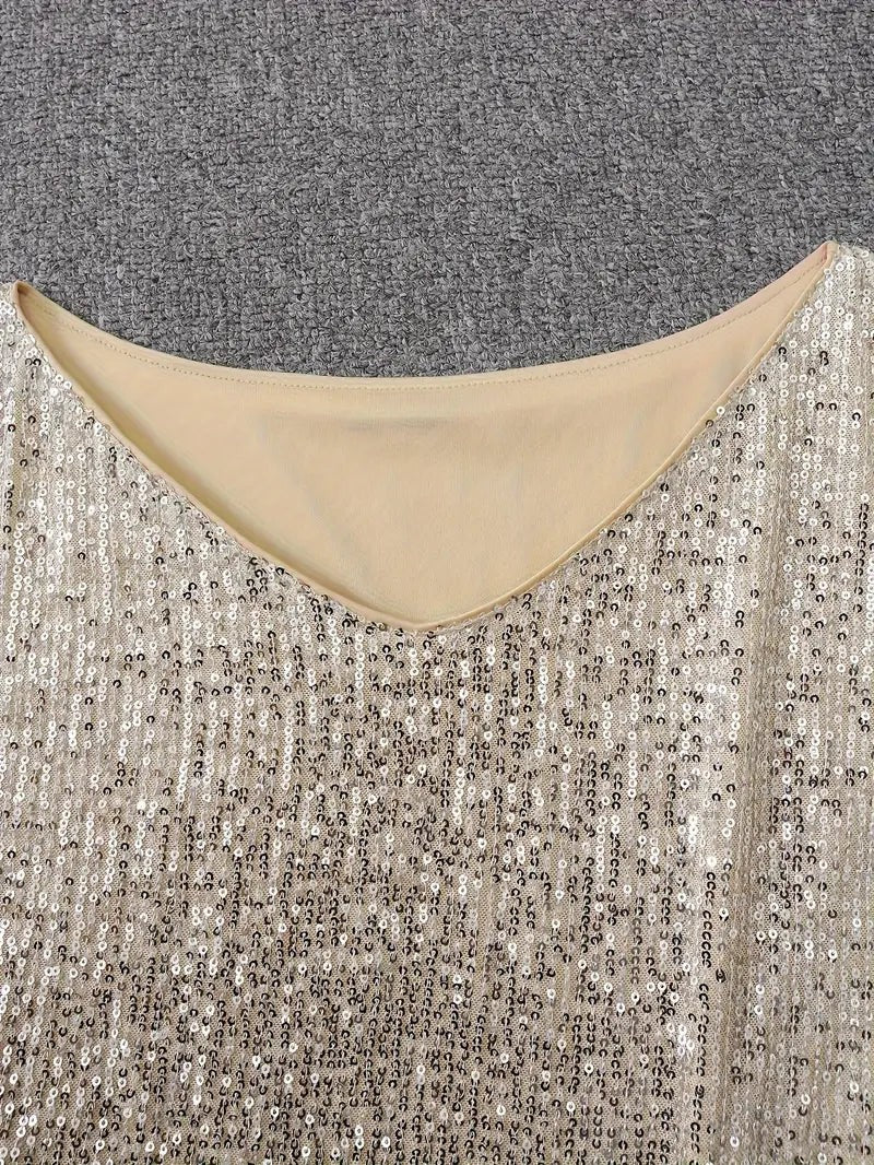 Close-up of cream sequin dress neckline with nude lining trim