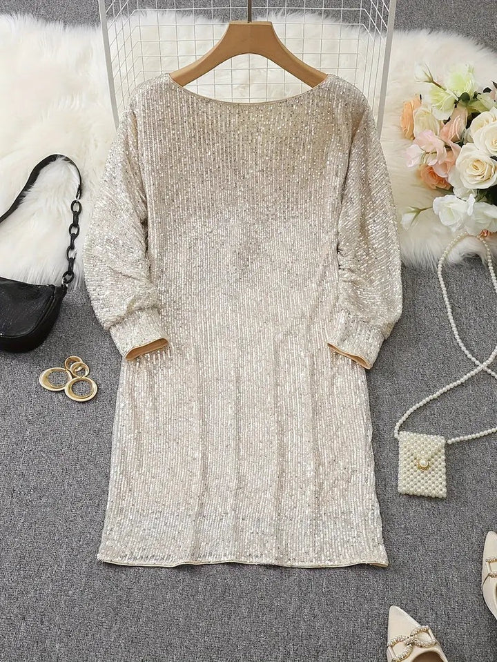 Cream sequin mini dress on hanger, back view with long sleeves