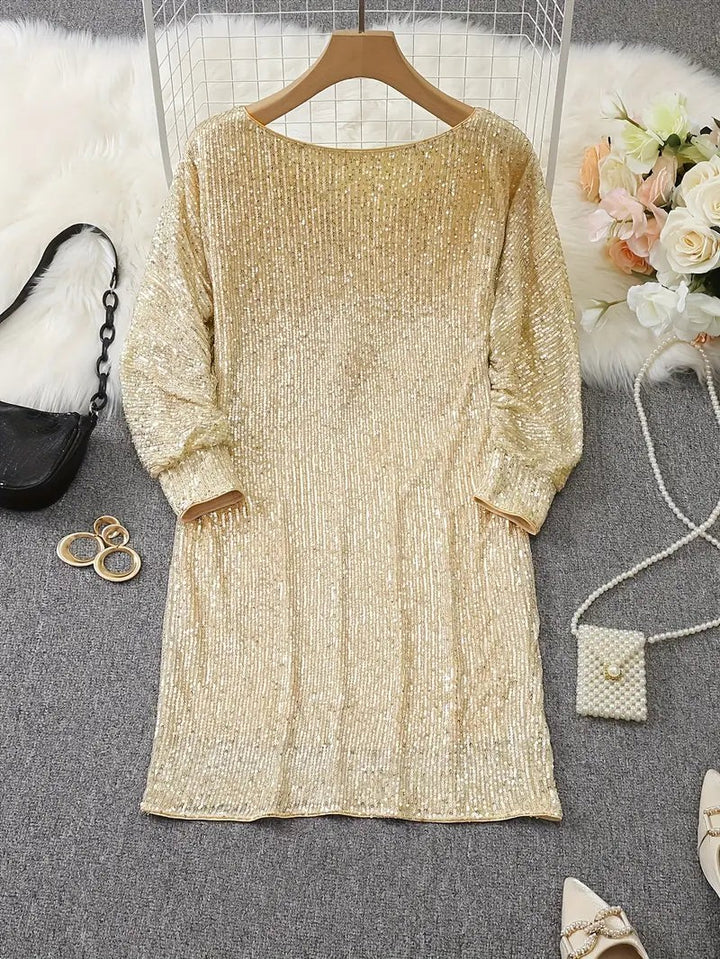 Gold sequin mini dress on hanger, back view showing relaxed sleeves