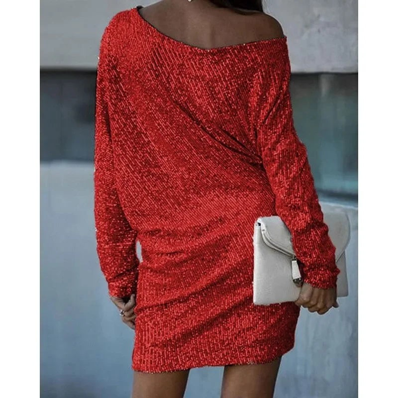 Red sequin mini dress showing relaxed batwing sleeves, back view