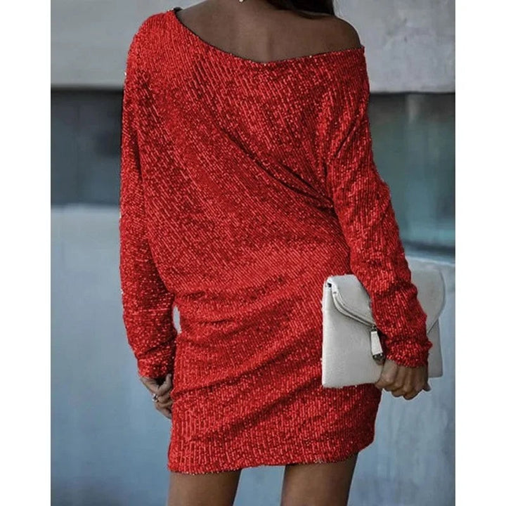 Red sequin mini dress showing relaxed batwing sleeves, back view