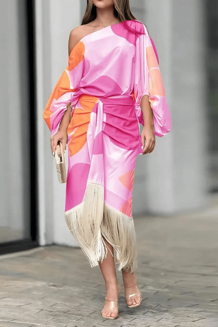 Close-up of tasselled cuff and colour-block print on midi dress sleeve