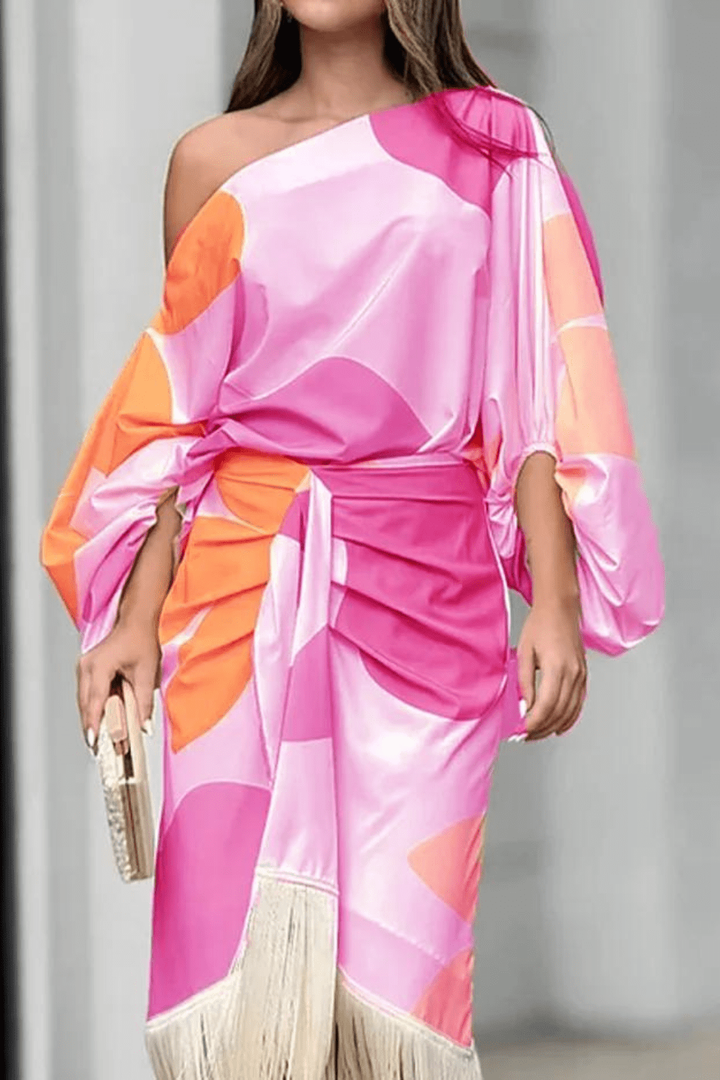 One-shoulder midi dress in pink and orange abstract print with fringe trim