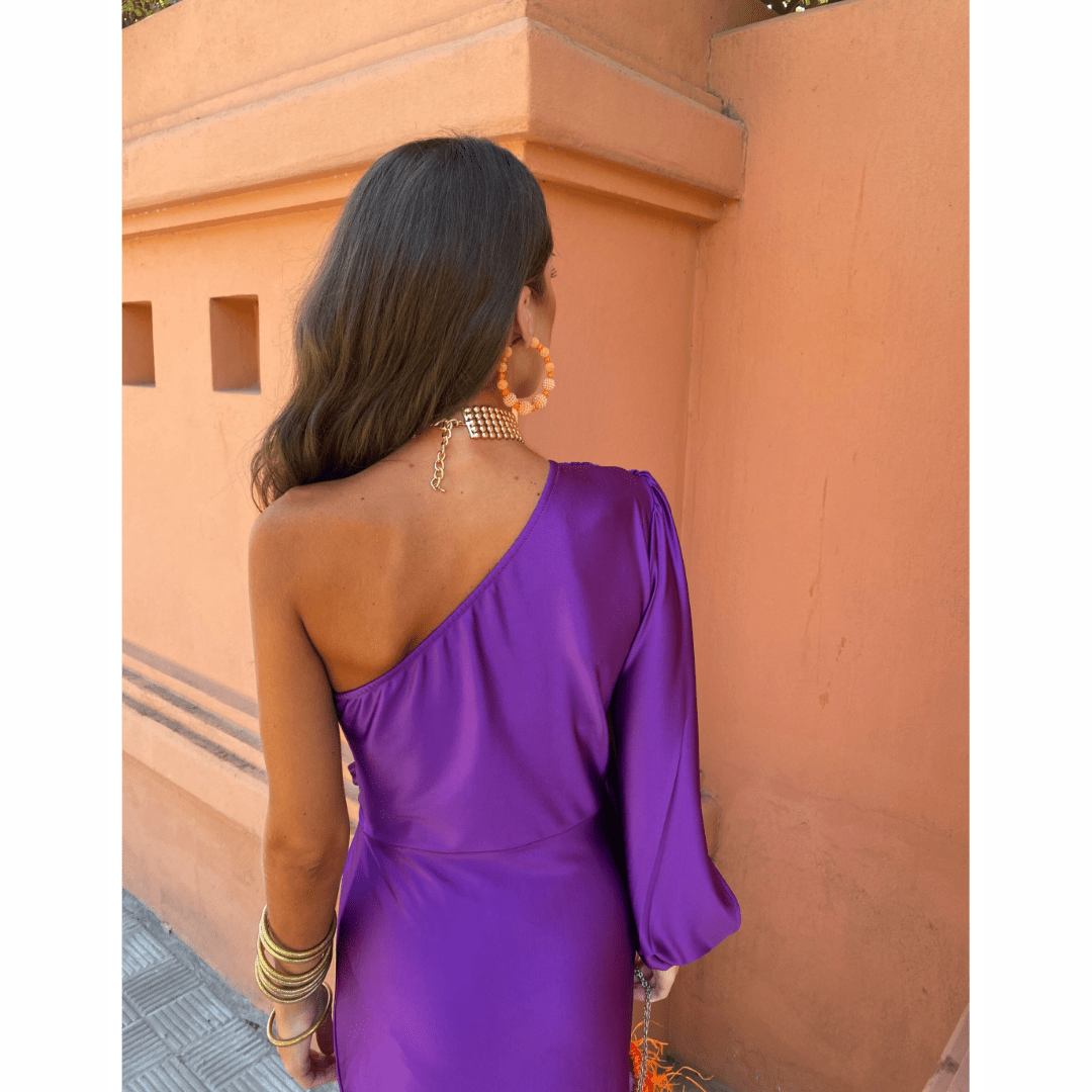 Back view of purple satin one-shoulder dress with billowing long sleeve