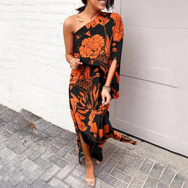 Black and orange floral one-shoulder maxi dress with flowing batwing sleeve