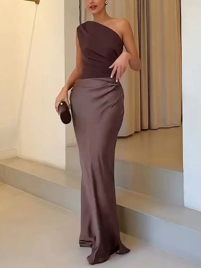 Brown satin maxi dress with asymmetric neckline and ruched hip detail