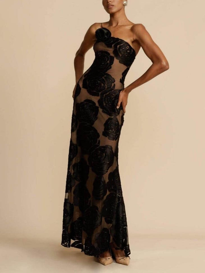 Sheer black floral gown with rosette shoulder detail on model