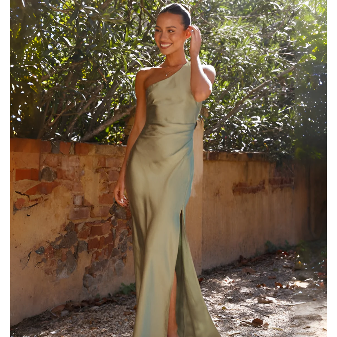 Model wearing sage satin one-shoulder maxi dress with ruched waist detail