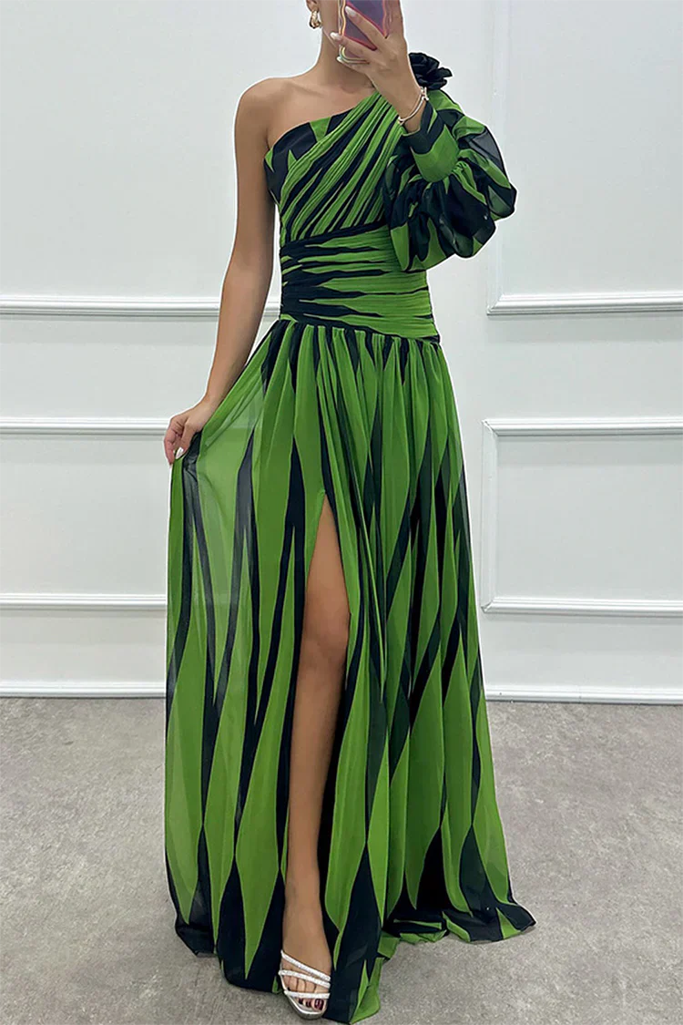 Green and black striped one-shoulder gown featuring puff sleeve and leg slit