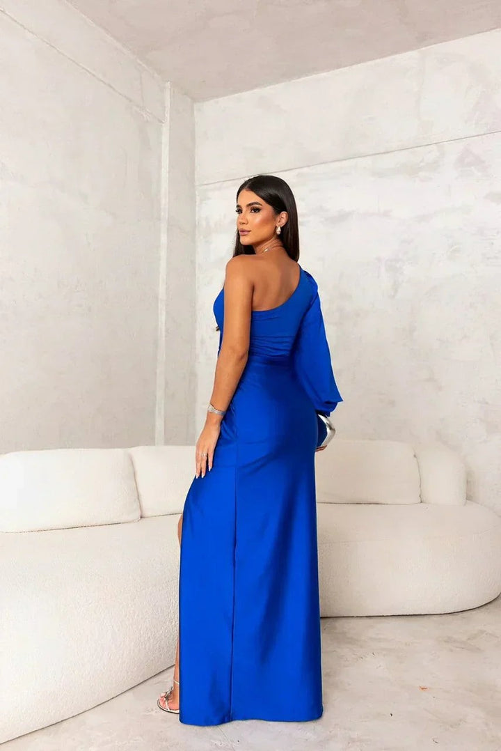 Back view of cobalt blue satin evening dress with draped one-shoulder sleeve