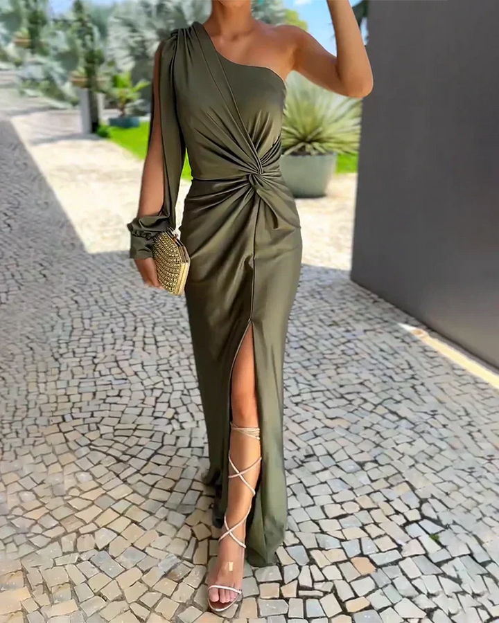 Khaki one-shoulder maxi dress with twist-front detail and split hemline, worn with strappy heels