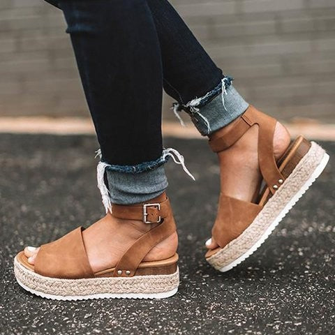 Tan suede espadrille wedge sandals with ankle strap and buckle detail