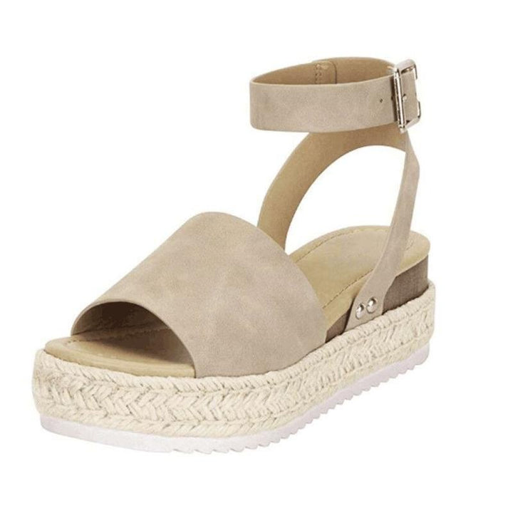 Beige suede ankle-strap wedge sandal with silver buckle and jute sole
