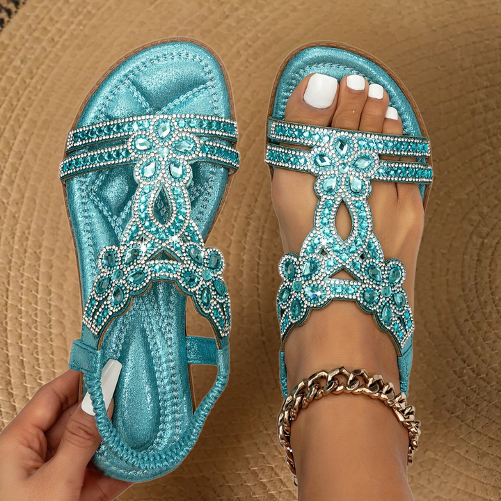 Turquoise flat sandals with sparkling rhinestone floral straps and elastic heel strap