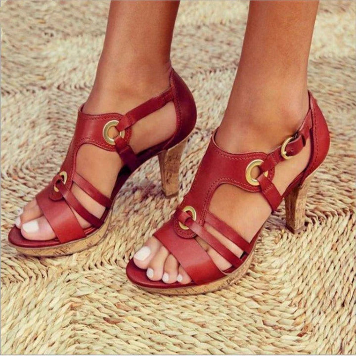 Red leather strappy heeled sandals with cork-effect stiletto heel and gold eyelets
