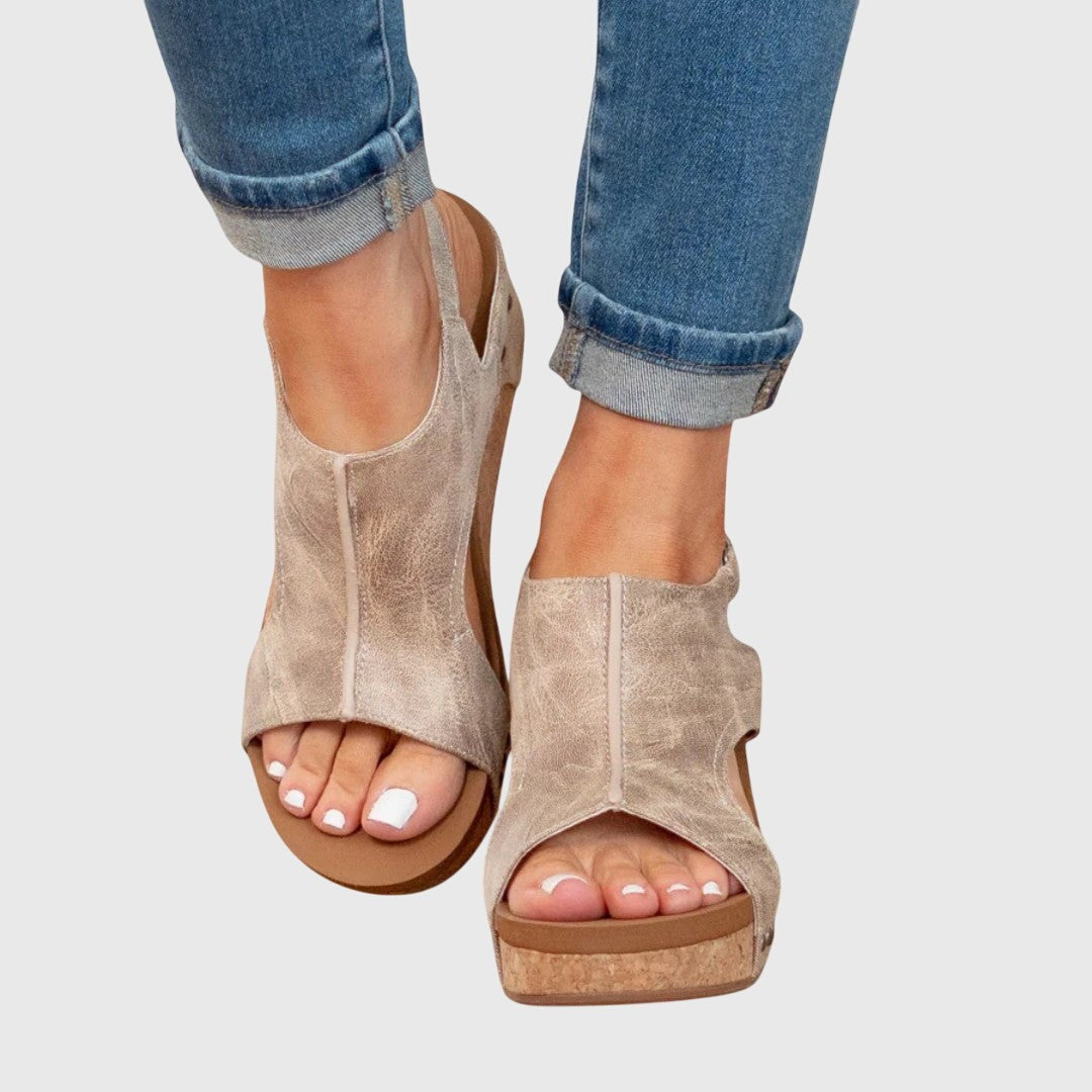 Taupe leather peep-toe wedge sandals with cork platform sole, worn with cuffed jeans