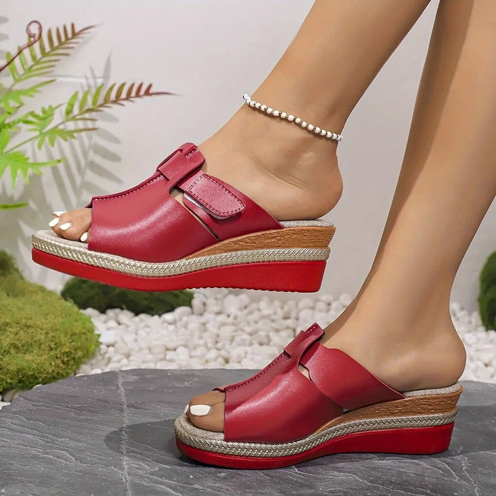 Yellow leather wedge sandals with cut-out strap detail and braided base
