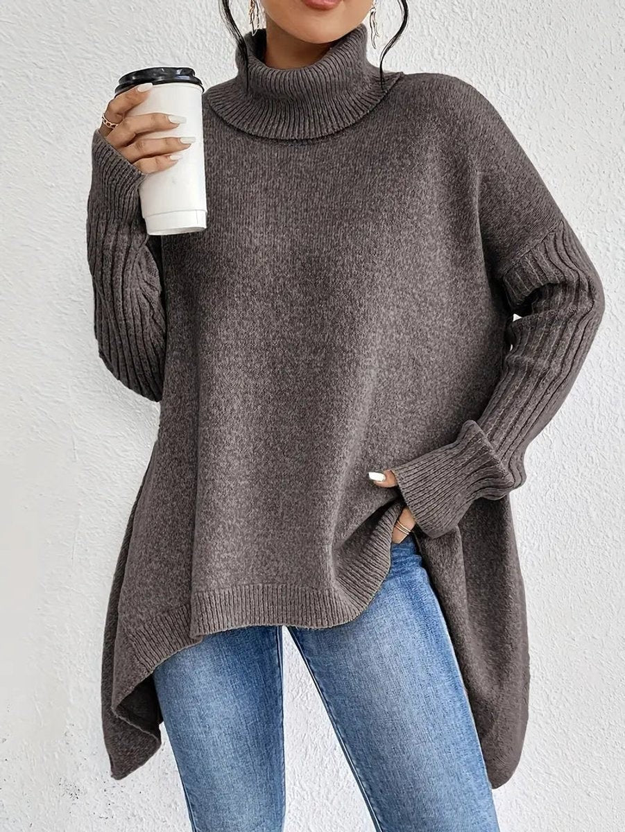 Taupe brown oversized turtleneck jumper featuring ribbed cuffs and side splits