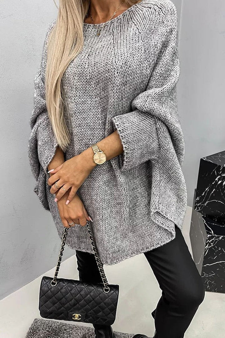 Grey chunky knit oversized jumper styled with black leather trousers