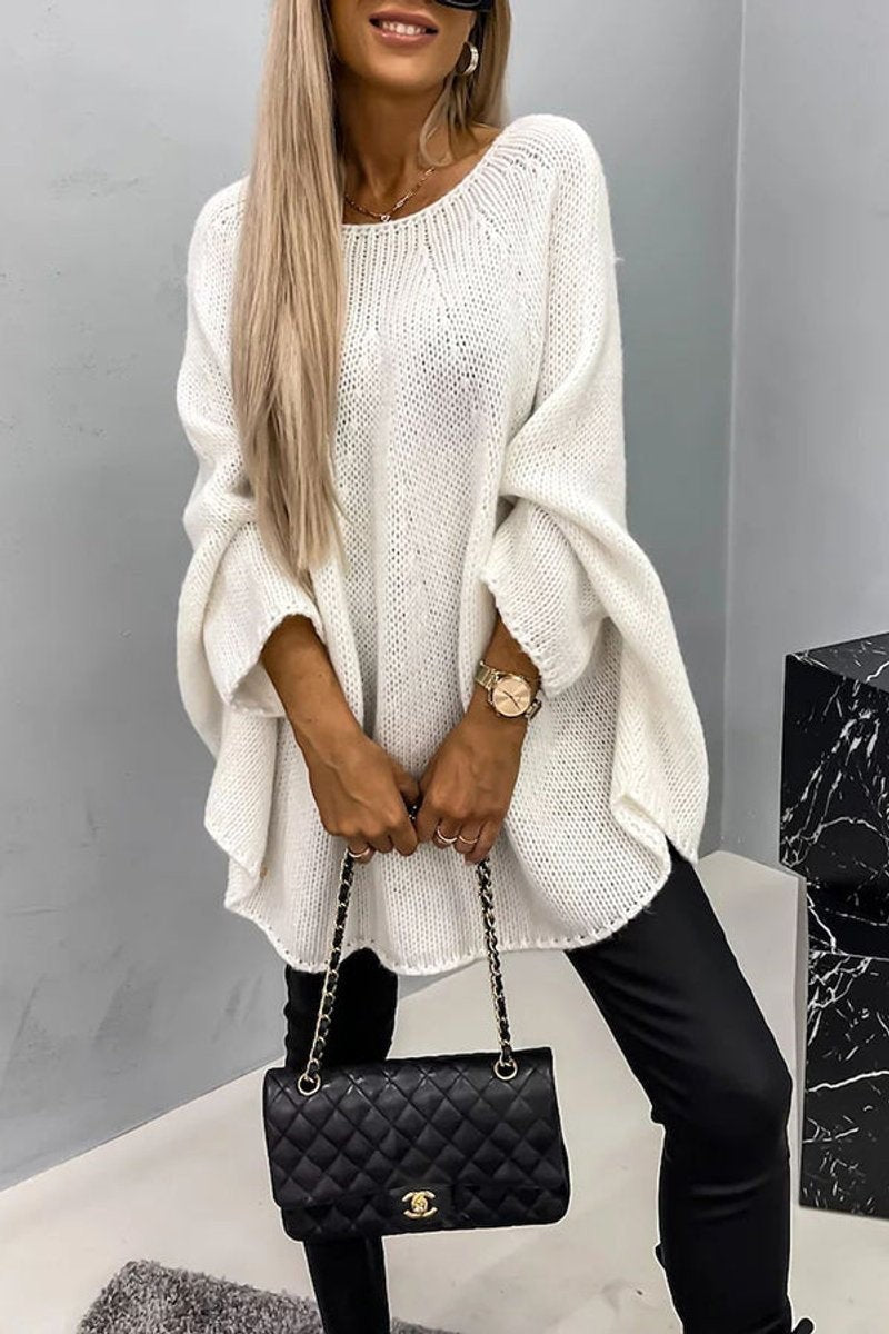 White oversized knit jumper with dropped shoulders and curved hem