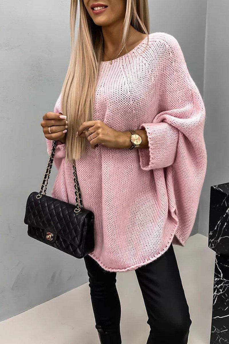 Pink oversized knit jumper with wide batwing sleeves and ribbed cuffs