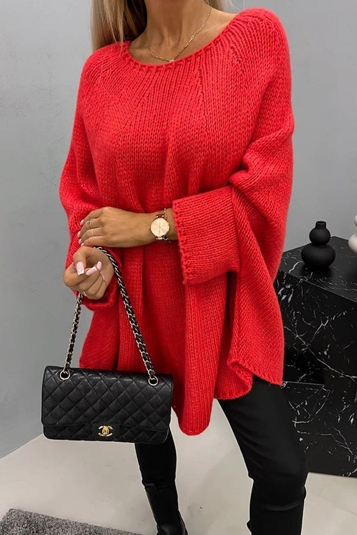 Red oversized knit jumper with round neck and relaxed batwing fit