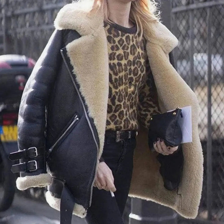 Black leather-look shearling jacket with cream fleece lining and buckles