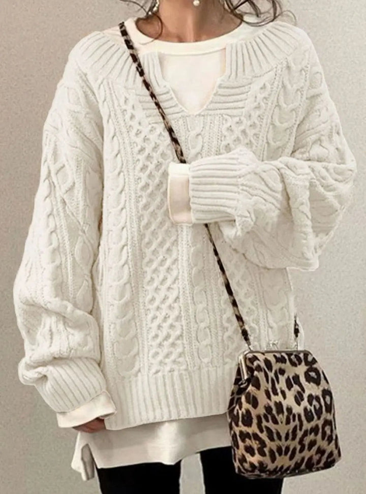 Cream cable knit jumper with layered white top and leopard print crossbody bag