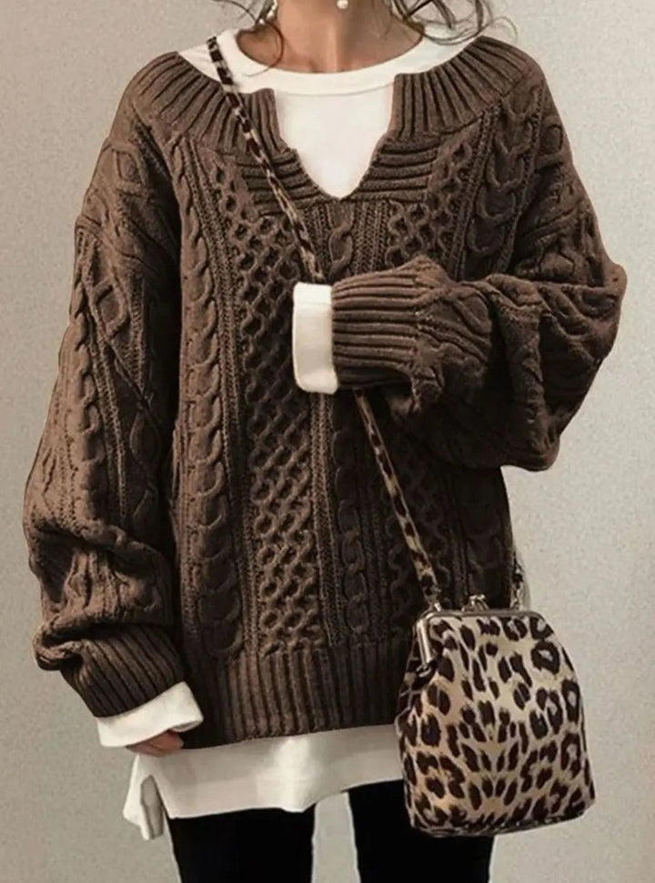 Brown cable knit jumper with cut-out neckline and layered white underlayer