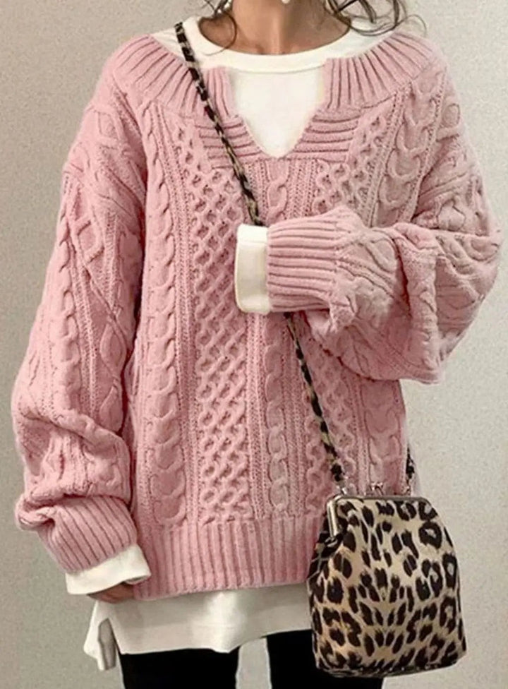 Blush pink cable knit sweater with V-neck cut-out and layered top