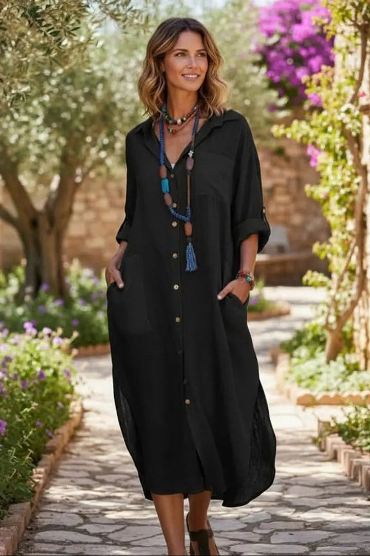 Model wearing black button-front midi shirt dress with front pockets