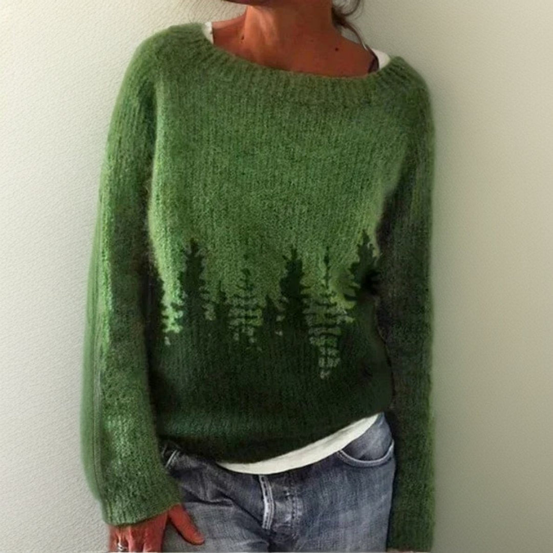 Green knitted jumper with pine tree forest print and round neckline