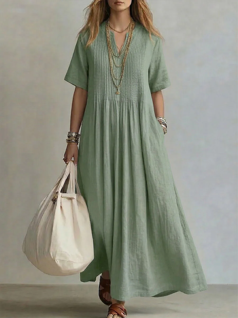 Sage green linen maxi dress featuring pleated V-neck bodice