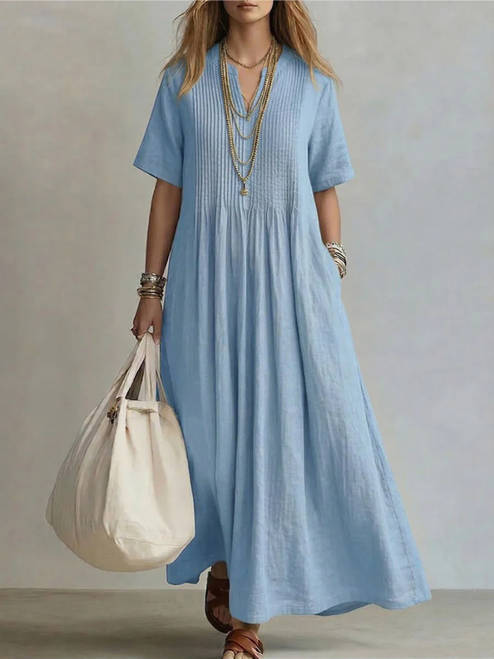 Pale blue linen maxi dress with pintucked front and short sleeves