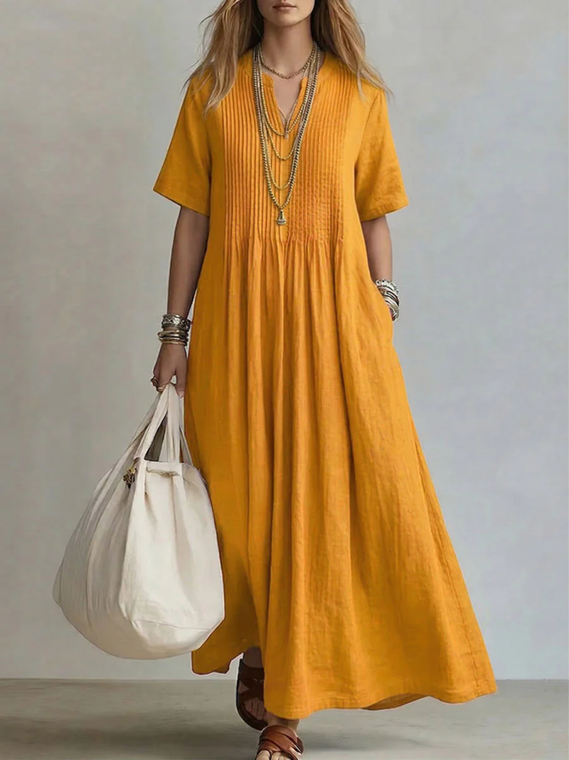 Mustard yellow linen maxi dress showcasing pleated V-neckline
