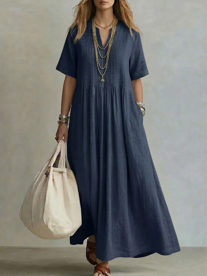 Navy linen maxi dress with pintuck detailing and flowing skirt
