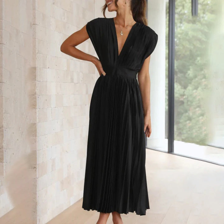 Cobalt blue pleated dress rear view showing tie-back neckline detail