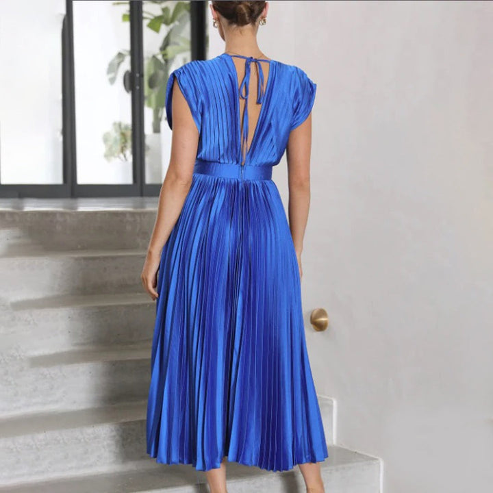 Cobalt blue pleated satin dress with fitted waistband and cap sleeves