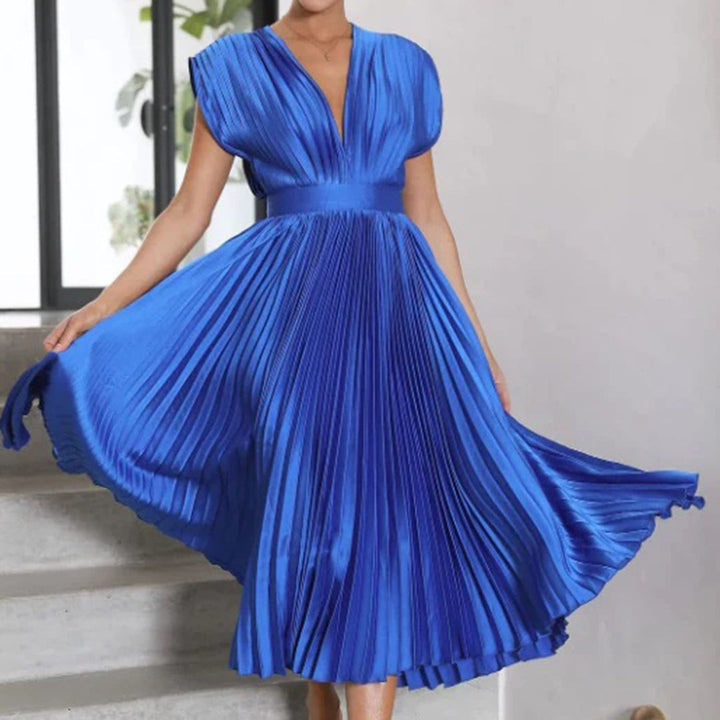 Cobalt blue pleated satin dress swirling with fitted waistband
