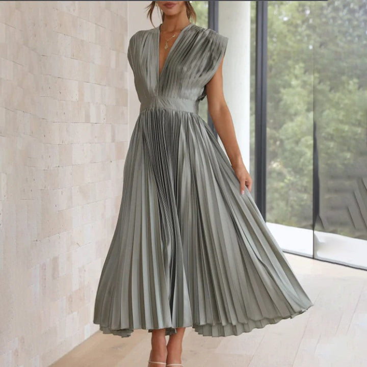 Sage green pleated satin dress with cap sleeves and gathered waist