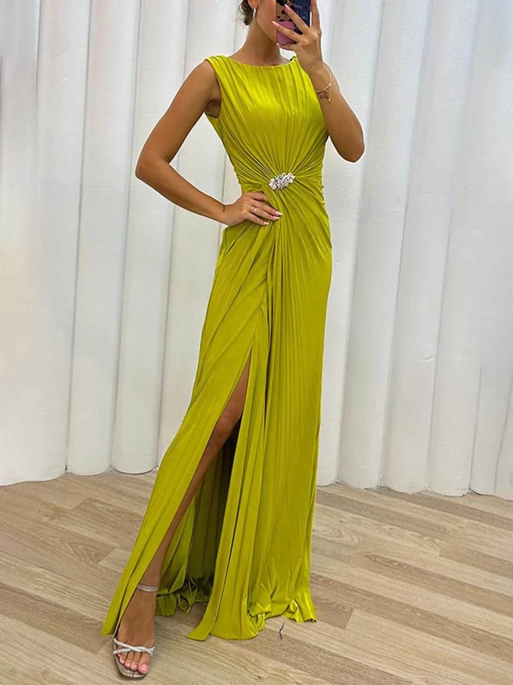 Chartreuse pleated maxi dress with ruched waist embellishment and thigh split