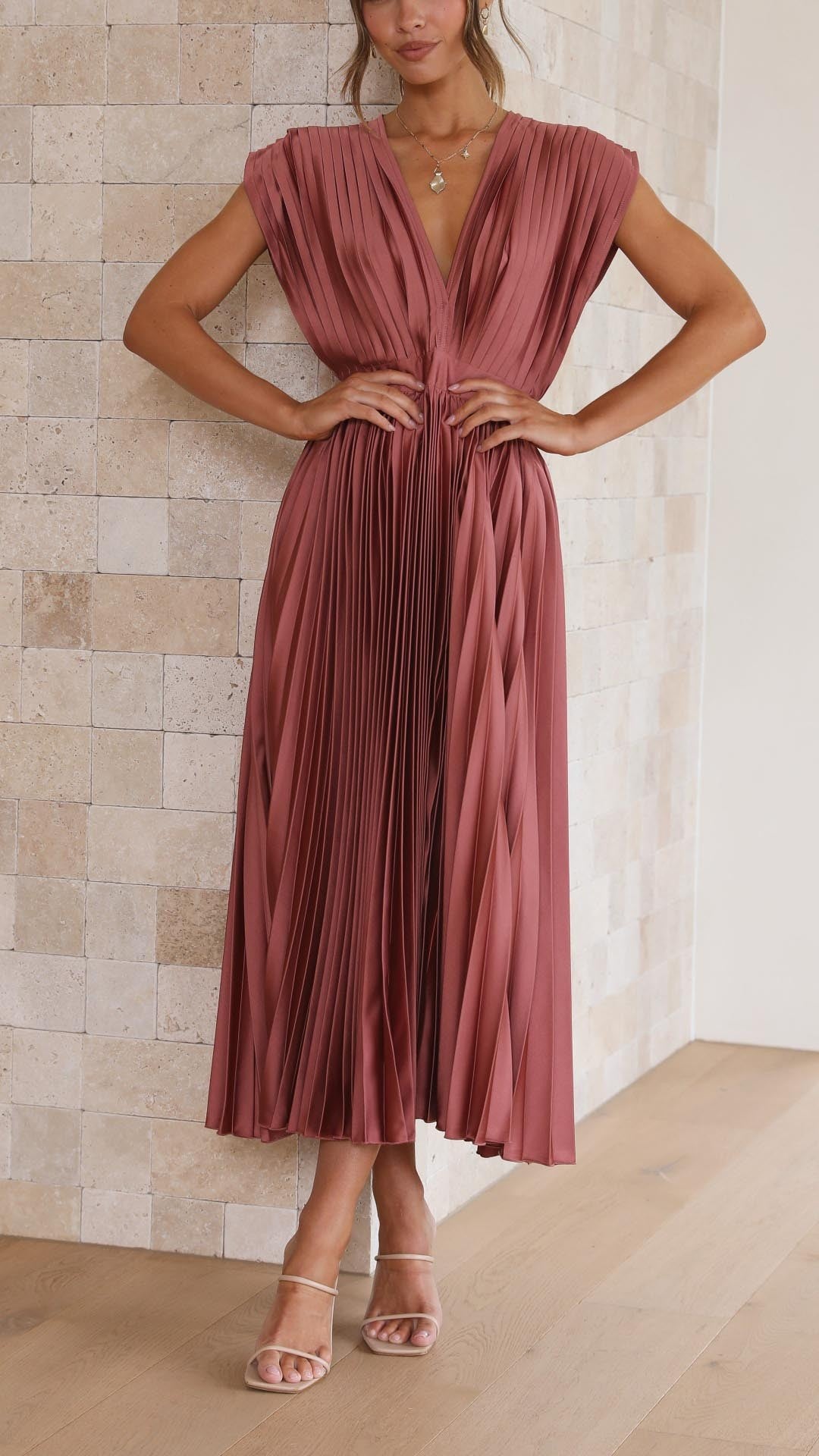 Rust pink pleated satin maxi dress with plunging V-neckline and cap sleeves