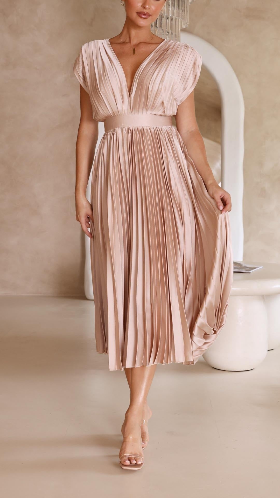Blush pink pleated satin dress with deep V-neck and cap sleeve detail