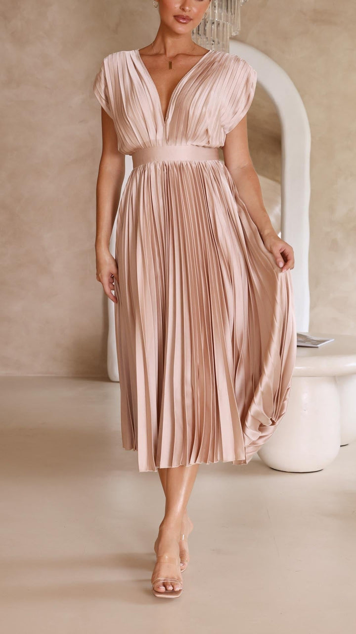 Blush pink pleated satin dress with deep V-neck and cap sleeve detail