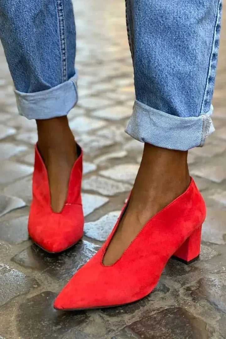 Red suede block heel court shoes featuring pointed toe and deep V-cut vamp