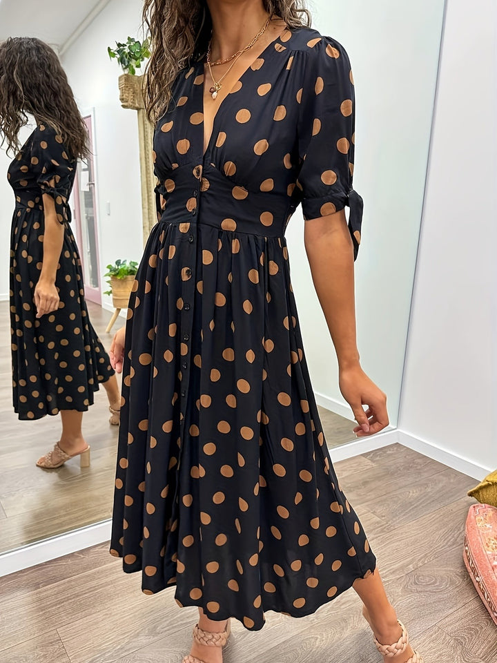 Button-front polka dot midi dress with fitted waist and flared skirt