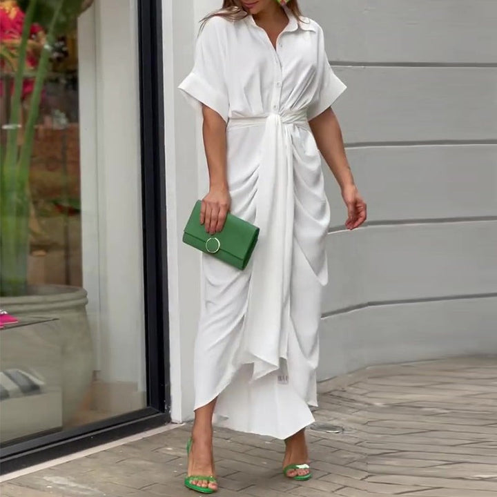 White belted wrap midi dress styled with green strappy heeled sandals