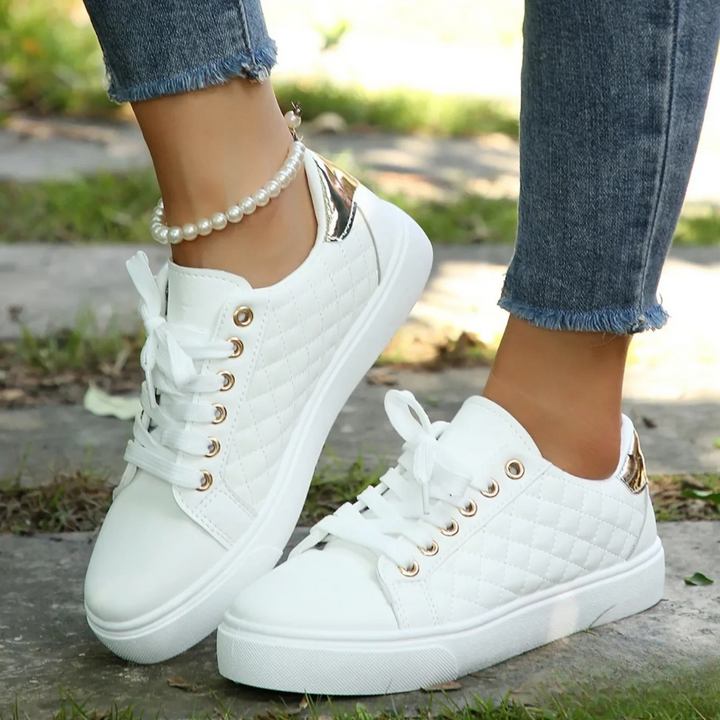 White quilted Clarice orthopaedic trainers with gold eyelets and metallic heel trim