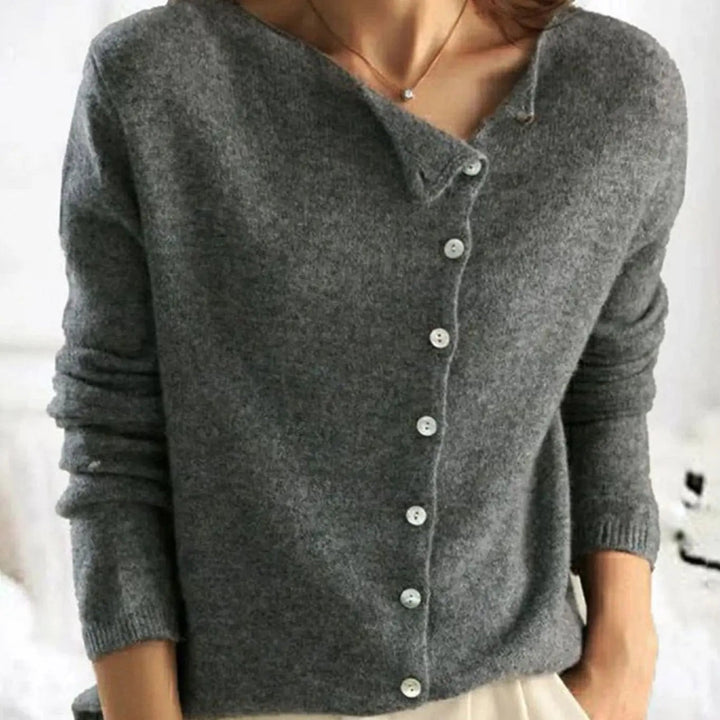 Charcoal grey knit jumper featuring off-centre buttoned neckline detail